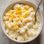 close-up of cheesy protein mac and cheese with fork
